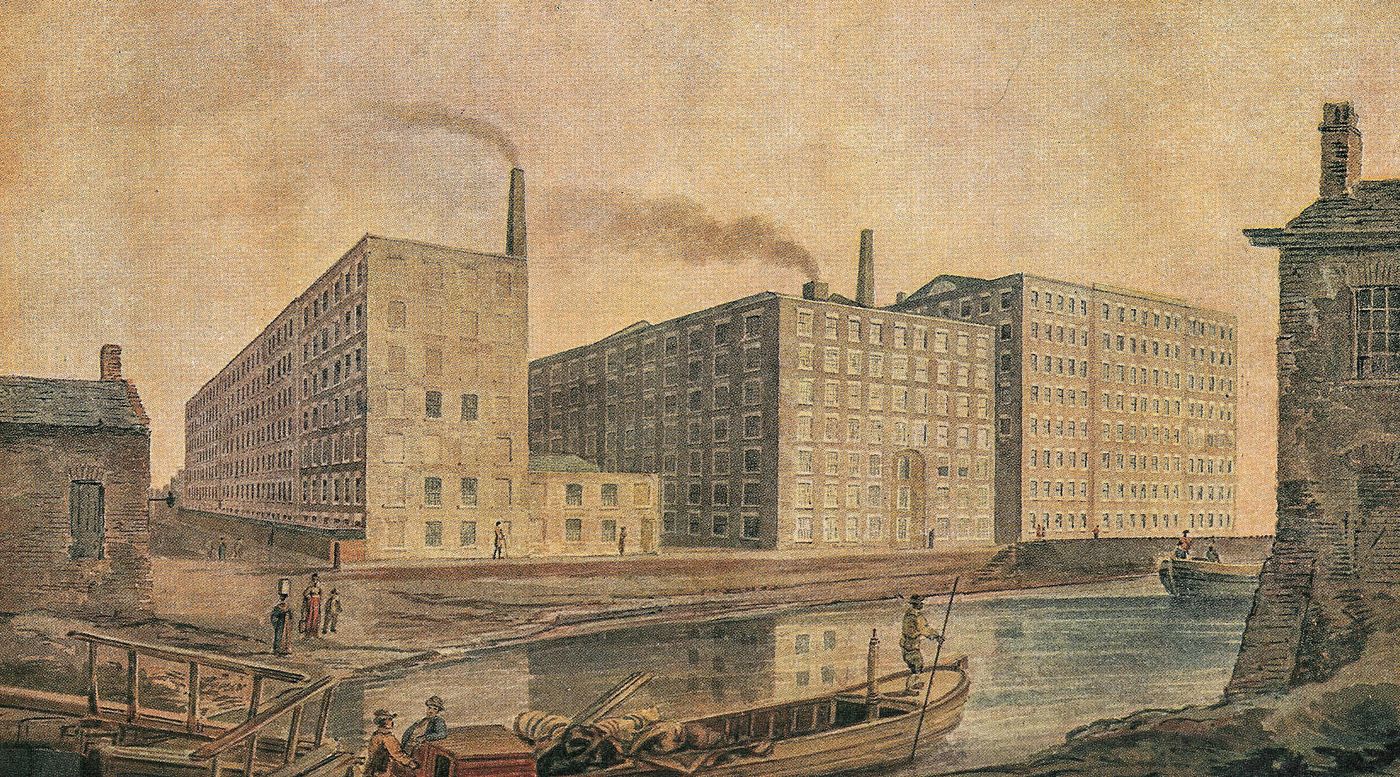 Oude prent van katoenmolens langs een kanaal in Manchester